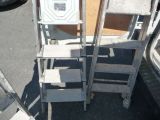 two ladders that are sitting next to each other