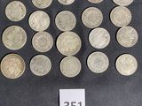 a lot of coins on a table with a price tag