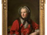 portrait of a young girl in a red dress holding a book