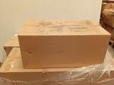a stack of boxes sitting on top of each other in a room