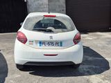 a small white car parked in a parking lot