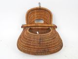 an image of a wicker purse hanging on a wall