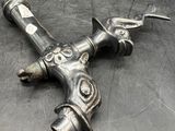 a metal object that is laying on a metal surface