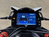 a close up of a motorcycle ' s dashboard with a digital display