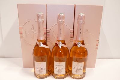 three bottles of wine sitting next to each other on a table