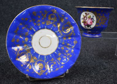 blue and gold china cup and saucer