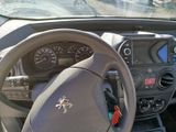 dashboard of a car with a steering wheel and dashboard controls