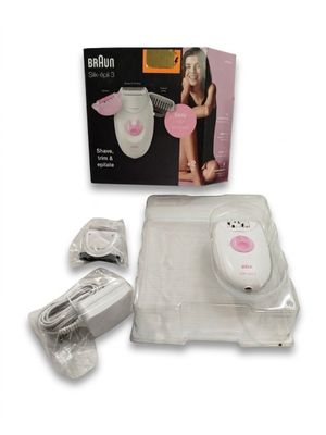 une image représentant un sèche-cheveux pour femme, avec une boîte posée à côté