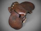 brown leather mittens with brass studs and rivets