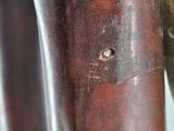 a close up of a metal object with a hole in it