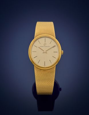 an image of a close up of a wrist watch on a blue background