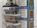 a stack of three boxes with a toy train in it