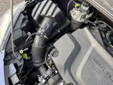 the engine of a car with its hood open and the hood down
