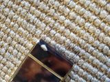 a picture of a cell phone laying on a carpet