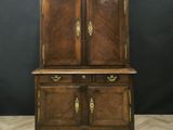 an old wooden cabinet with two doors and two drawers