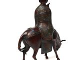 a statue of a man riding a horse with a hat on