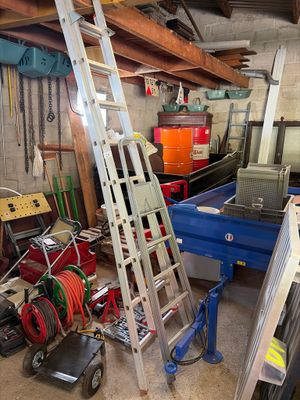 a ladder that is leaning against a wall in a garage