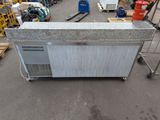 an image of a kitchen island in a warehouse