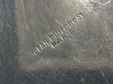 a close up of a silver plate with a name engraved on it