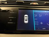 a close up of a car ' s dashboard with a digital display