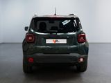 the back end of a green jeep parked in a room