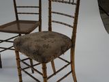 two chairs that are next to each other on a white background