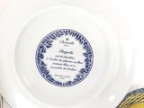 a white plate with a blue and white design on it