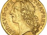 gros plan d'une pièce d'or portant un visage de femme