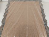 a piece of plastic wrap on top of a piece of wood