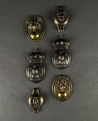 a close up of a group of metal buttons on a table