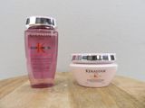 a bottle of kerastase and a jar of cream on a table