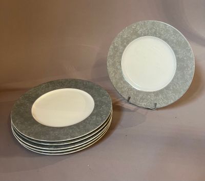 four plates stacked on top of each other on a table