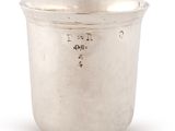 an antique silver cup on a white background with a white background