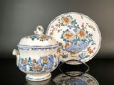 an image of a blue and white bowl and saucer on a table