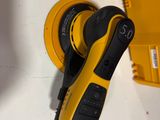 someone is using a cordless drill to drill a hole in a wall