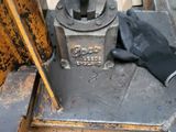 a close up of a machine with a glove on it