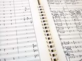 an open book with music notes on it