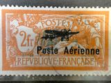 a close up of a stamp with an airplane on it