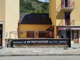 a yellow building that has a sign on the side of it