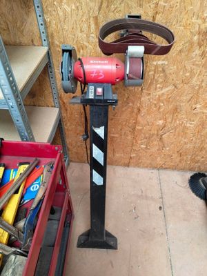 a red machine that is sitting in a garage