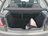 the back of a car with the trunk open and a blanket in the trunk