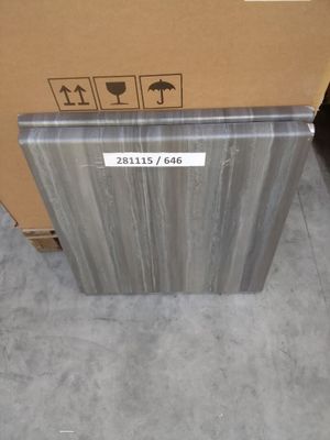 a cardboard box with a sign on it sitting on the floor