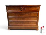 a wooden chest of drawers with a marble top
