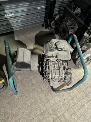 a motorcycle that is parked in a garage next to some tools