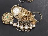 a bunch of jewelry that is laying on a table