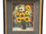 une peinture à l'huile représentant un vase de tournesols posé sur une table