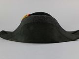 a black hat with a red and yellow bead on it