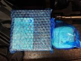 a bag of ice and a bag of water on the seat of a car