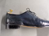 a pair of shoes hanging on a wall in a room