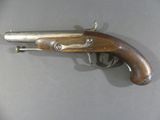 an old gun that is on display on a table